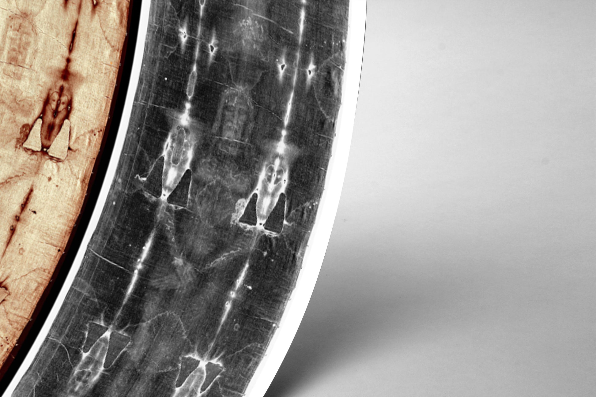 The image is a close-up of a curved, textured surface with a black and white pattern.