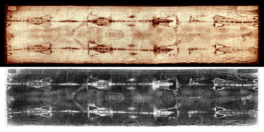 The image is a black and white photograph of a textured surface, possibly a piece of fabric or paper, with a repeating pattern of shapes or designs.