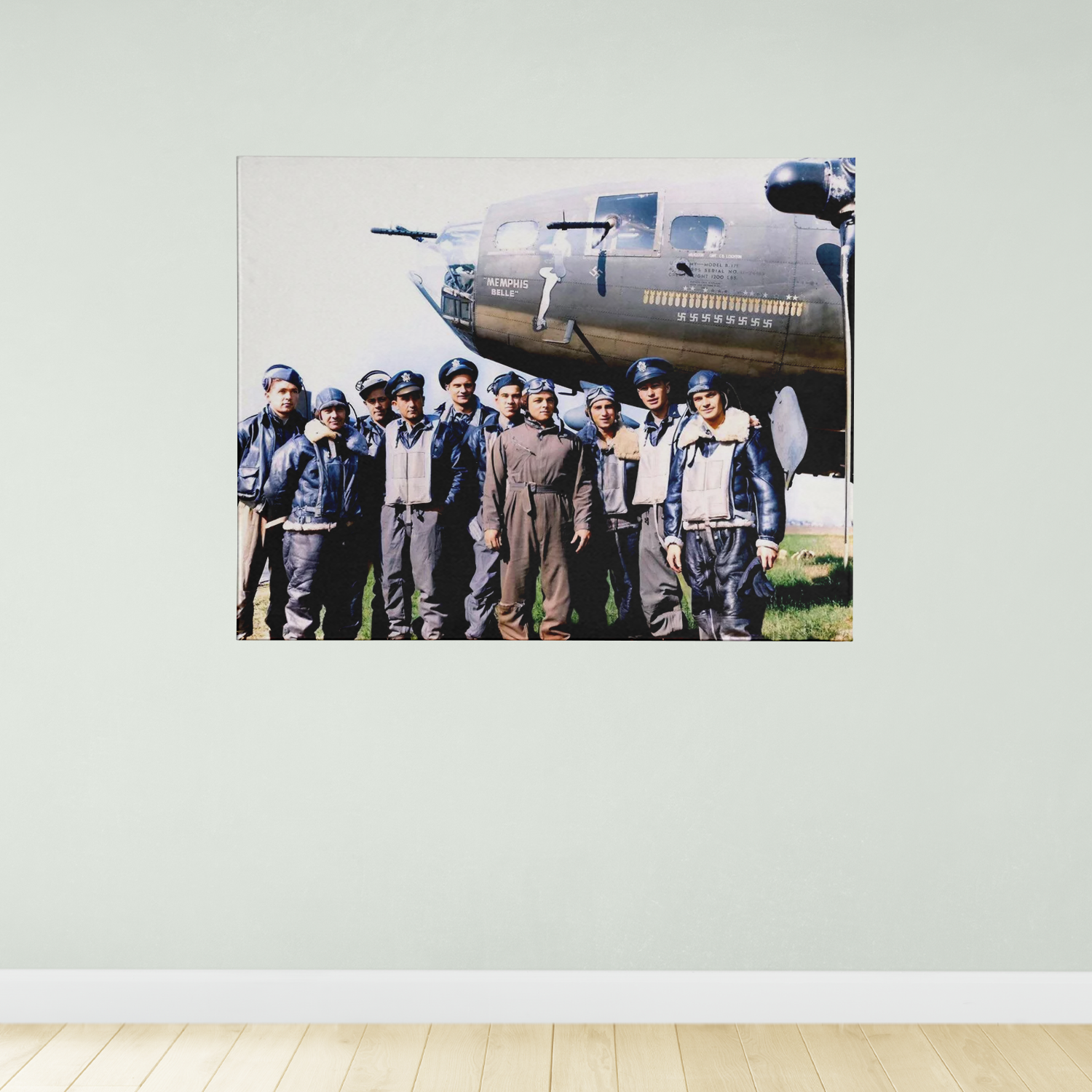 A group of men in military uniforms standing in front of a large military aircraft.