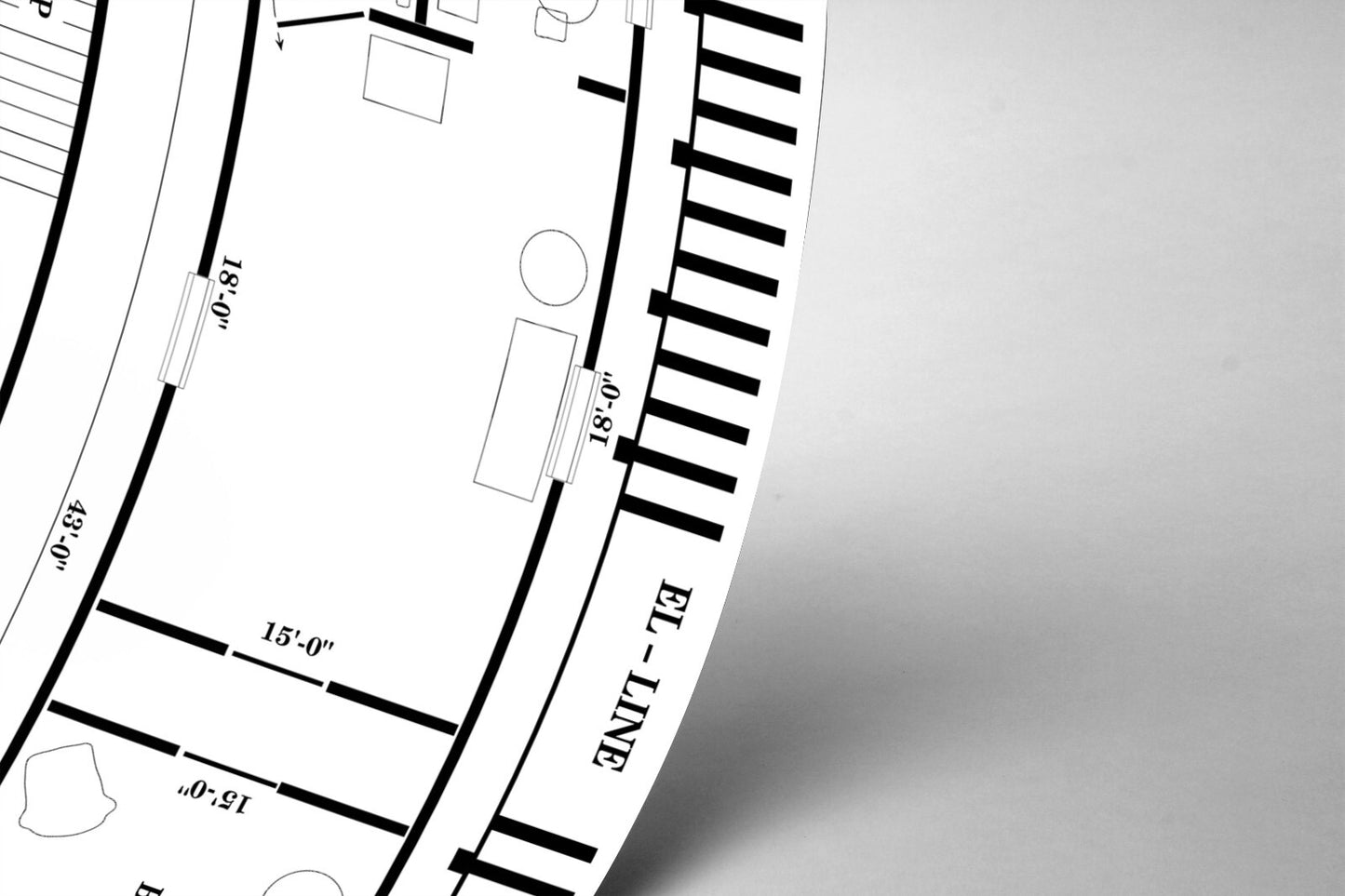 The image is a black and white photograph of a technical drawing or diagram, featuring various lines, shapes, and measurements.
