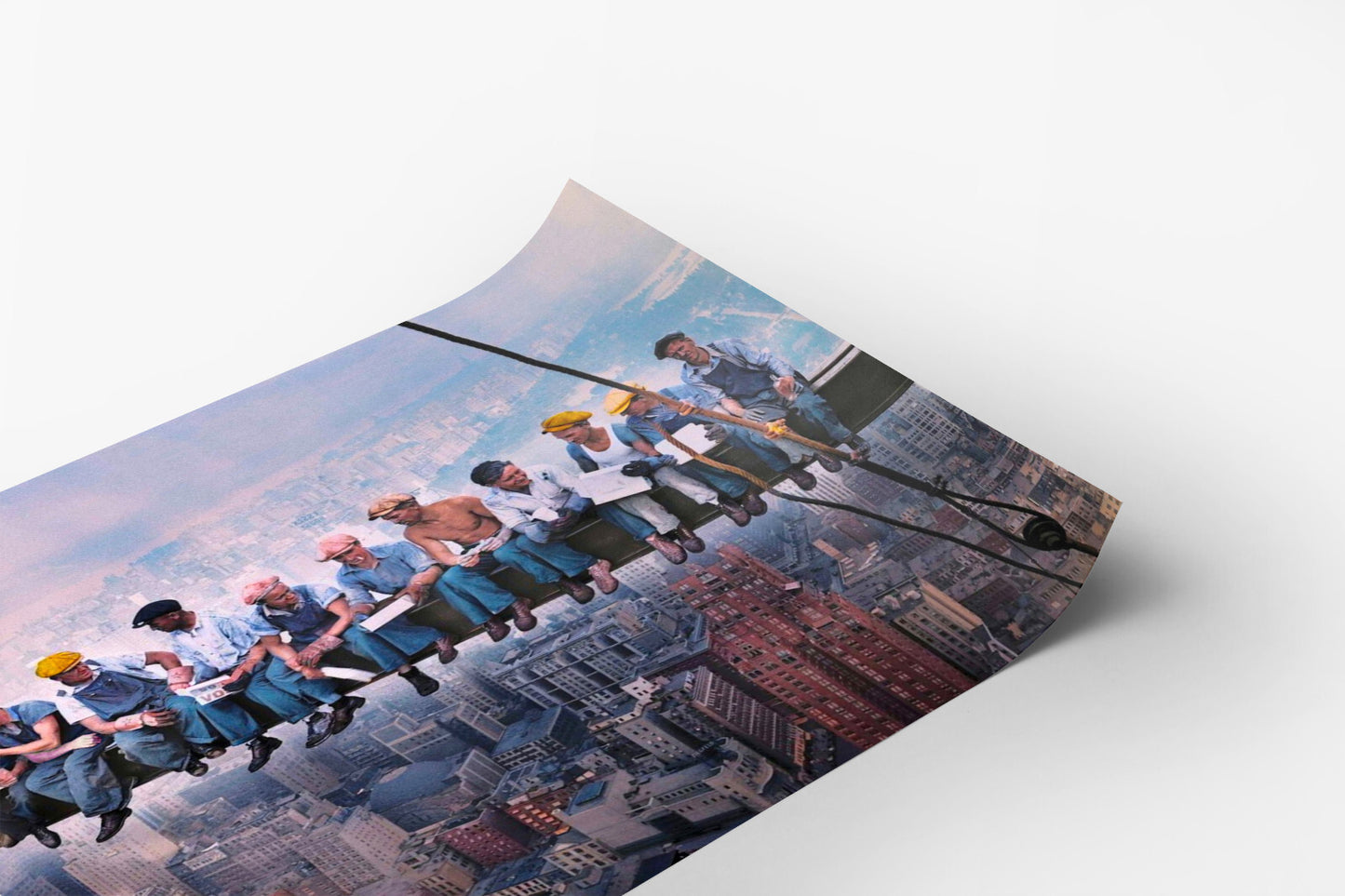 A group of people are hanging from a rope, suspended high above a cityscape, with the city below them.