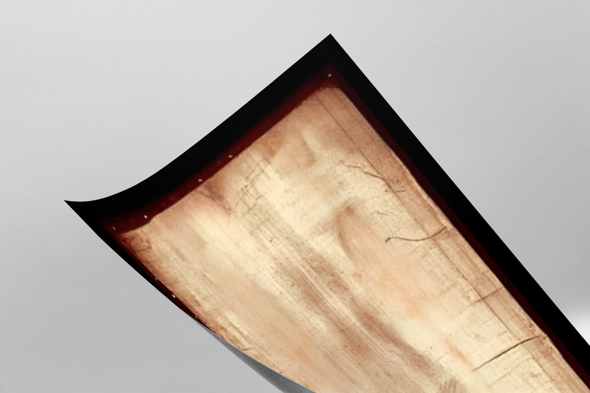 a close-up view of a wooden surface with a textured, aged appearance.