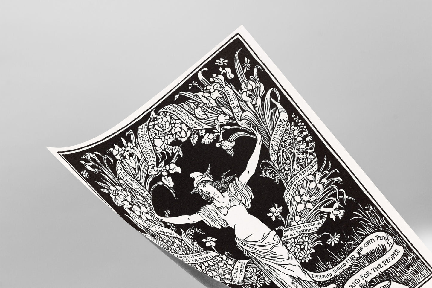 The image is a black and white illustration featuring a woman with her arms raised, surrounded by a floral design.
