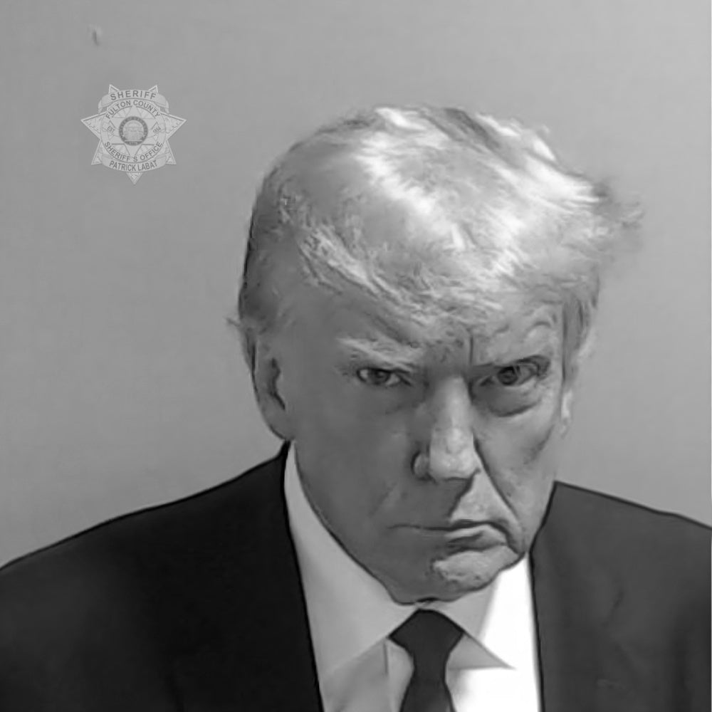 A black and white portrait of a man wearing a suit and tie, with a serious expression on his face.