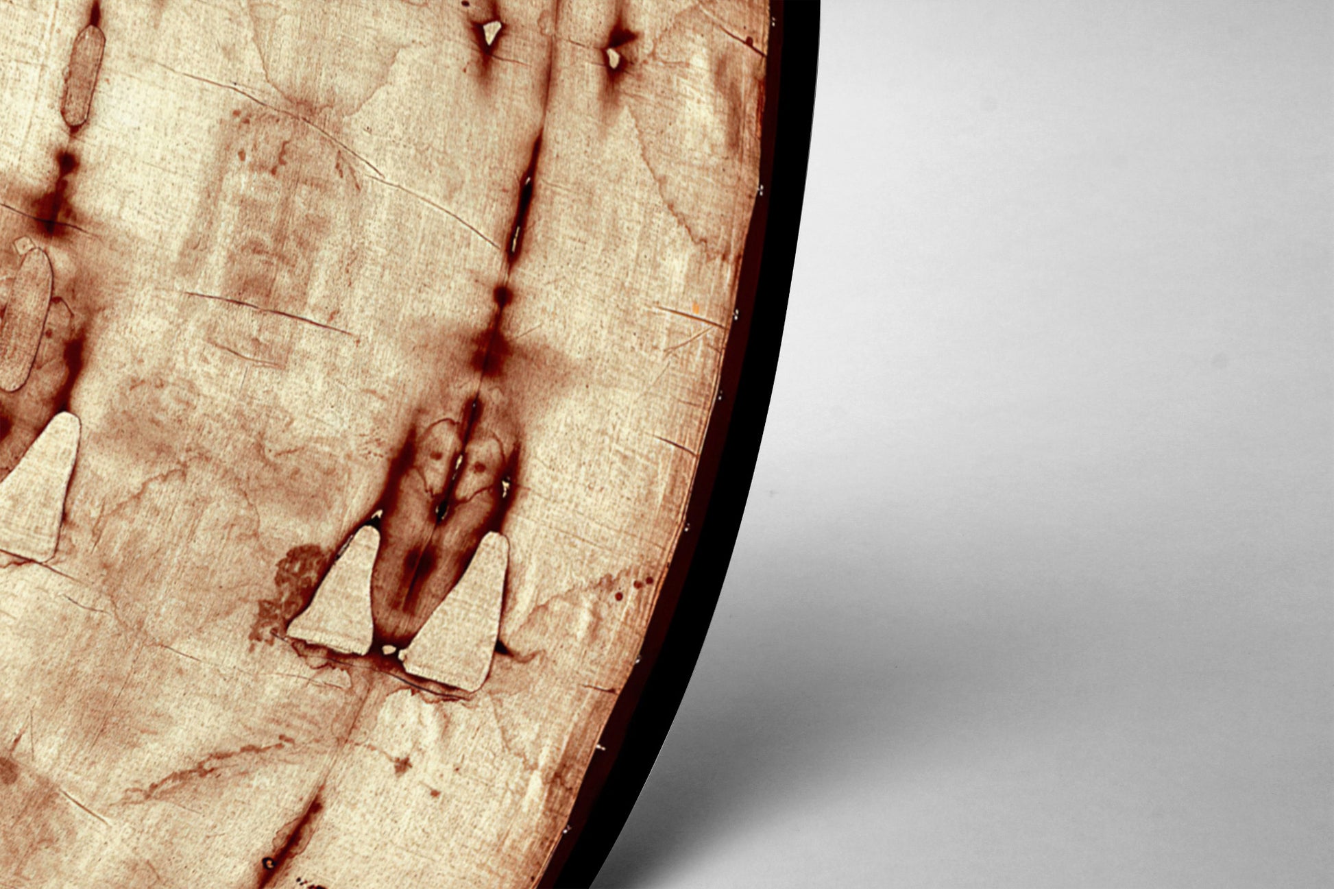 a close-up view of a wooden surface with a dark brown, textured appearance.