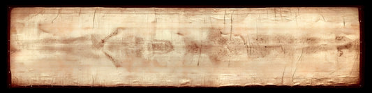 The image is a close-up of a wooden surface with visible scratches and marks, giving it a worn and aged appearance.